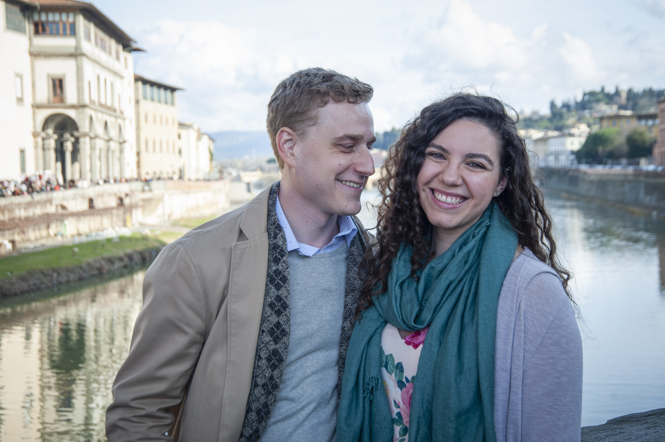 happy couple on Ponte Vecchio in Florence on their honeymoon